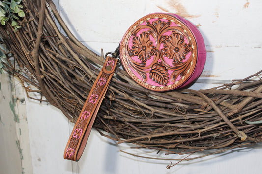 small tooled leather and pink wristlet